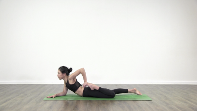 Yogi is practising yoga on a blue yoga mat on white background