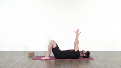 Yogi is practising yoga on a blue yoga mat on white background