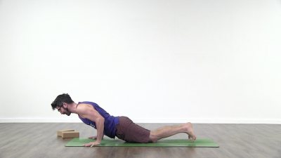 Yogi is practising yoga on a blue yoga mat on white background