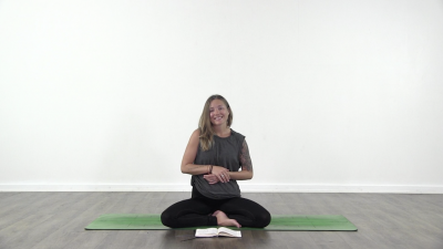 Yogi is practising yoga on a blue yoga mat on white background