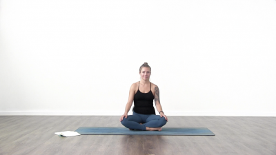 Yogi is practising yoga on a blue yoga mat on white background