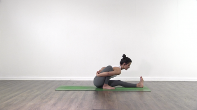 Ashtanga vinyasa yoga seated forward fold with bind