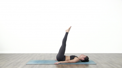 Yogi is practising yoga on a blue yoga mat on white background